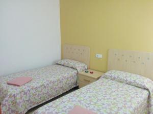Posteľ alebo postele v izbe v ubytovaní Apartamentos Vista