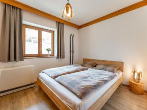 Łóżko lub łóżka w pokoju w obiekcie Chalet Tetteroo