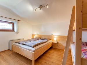 Łóżko lub łóżka w pokoju w obiekcie Chalet Tetteroo