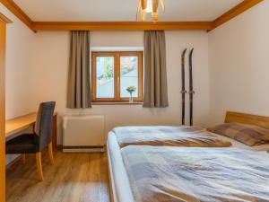 Łóżko lub łóżka w pokoju w obiekcie Chalet Tetteroo