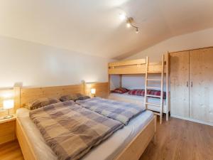 Łóżko lub łóżka w pokoju w obiekcie Chalet Tetteroo