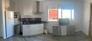 Kuchyňa alebo kuchynka v ubytovaní Apartamento María Burgos + 4 fotografie