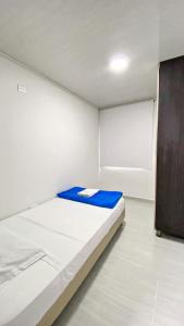 Voodi või voodid majutusasutuse Apartahotel222 Pereira 401 toas