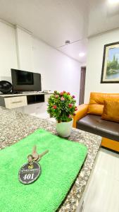 TV a/nebo společenská místnost v ubytování Apartahotel222 Pereira 401