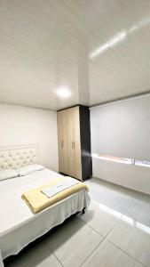 Katil atau katil-katil dalam bilik di Apartahotel 222 apartamento 402