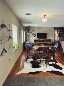 a dining room with a table and chairs at Wm. Farmer and Sons in Hudson