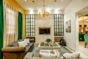a living room with a couch and a table at REGINA HOME in San Salvador de Jujuy