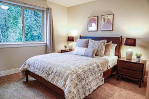 a bedroom with a large bed and a window at Issaquah's spacious pet-friendly home near I90 in Issaquah