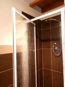 a shower with a glass door in a bathroom at FraMavi in Cefalù +27 photos