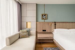 Ένα ή περισσότερα κρεβάτια σε δωμάτιο στο Zurich Marriott Hotel