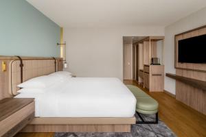 Ένα ή περισσότερα κρεβάτια σε δωμάτιο στο Zurich Marriott Hotel