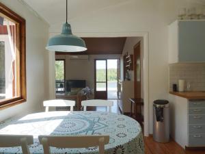 a kitchen and dining room with a table and chairs at 6 person holiday home in ÅKERSBERGA-By Traum in Åkersberga
