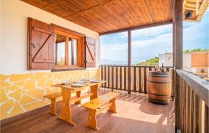 a tasting room with a wooden table and a barrel at Amazing Home In El Borge With Wifi in Moclinejo