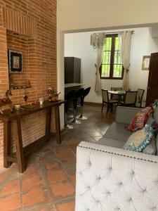 a living room with a couch and a table at Casa Anabel in Antigua Guatemala