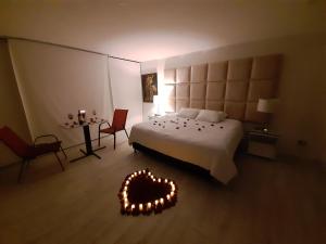 Postel nebo postele na pokoji v ubytování Mirador samsara Suite Luxury piso completo