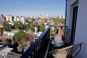 a balcony with a view of a city at Apartment 41 Melian in Buenos Aires