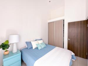 Postelja oz. postelje v sobi nastanitve Pura Vida Apartment with nice pool walking distance to the heart of Jaco