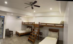 Postel nebo postele na pokoji v ubytování P&B Residences Legazpi