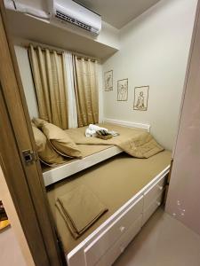 a small bedroom with a bunk bed in it at Luxe Staycation S Residences Tower 3 MOA in Manila
