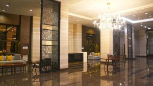 a lobby of a hotel with a chandelier at The Radiance Manila Bay in Manila