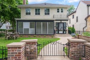 a house with a black gate and a patio at Twin City Terrace in Minneapolis
