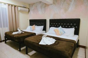 Postel nebo postele na pokoji v ubytování Boracay Grace Hotel + 22 fotografií
