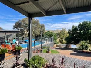 a view of the pool from the patio of a house at Omaroo High Country Retreat in Bonnie Doon