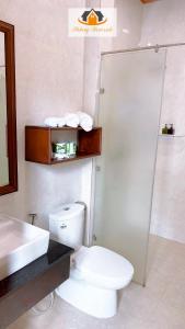 a bathroom with a toilet and a sink and a shower at Mekong Charm Riverside in Luang Prabang