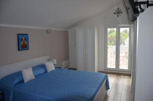 Postel nebo postele na pokoji v ubytování Terrazza Zalamella Bed and Breakfast
