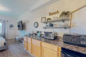a kitchen with a counter top and a microwave at Village of South Walton B247 in Inlet Beach