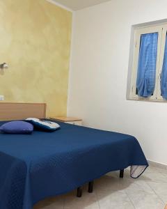 Кровать или кровати в номере Villa Angela case vacanza