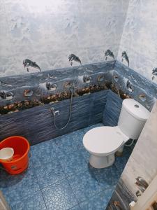 a bathroom with a toilet and a sink at Jerrys Holiday Home in Merces +18 photos
