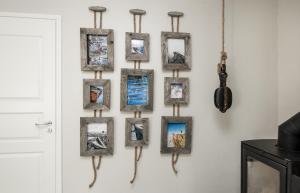 a group of frames hanging on a wall at Albatross 