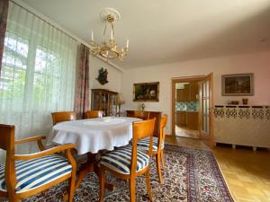 a dining room with a table and chairs at Luxury-Suites Traunsee in Traunkirchen