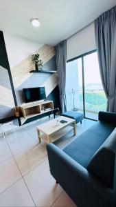 a living room with a couch and a table at Revo Home by AK Group in Cyberjaya