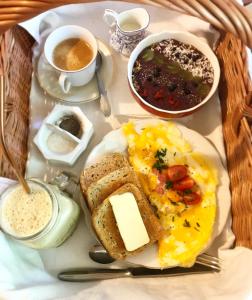 a plate of breakfast food with eggs toast and beans at Apartmány U rybníčku in Kostelec nad Vltavou