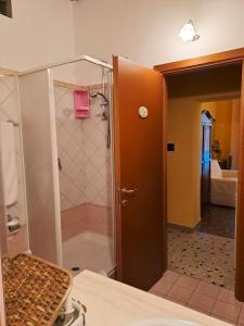a bathroom with a shower with a pink box at Bed And Breakfast Camere Primavera in Fondi