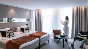 Postel nebo postele na pokoji v ubytování Hotel Tylösand