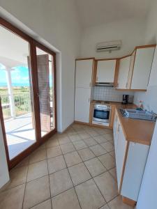 Kuchyň nebo kuchyňský kout v ubytování Apartments Pavlovic