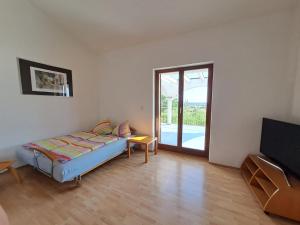 Postel nebo postele na pokoji v ubytování Apartments Pavlovic