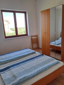 Postel nebo postele na pokoji v ubytování Apartments Pavlovic