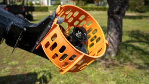 an orange plastic basket with a camera in it at Alexandros Hotel Apartments in Vourvourou