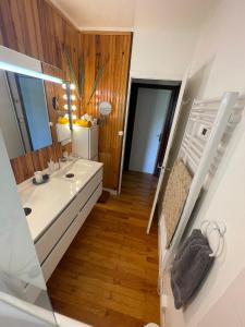 a bathroom with a sink and a mirror at Large Riverside Chalet Near Gorges du Verdon in La Bastide +56 photos