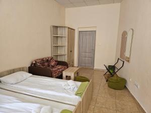 A bed or beds in a room at Coin Apartments & Poshtel