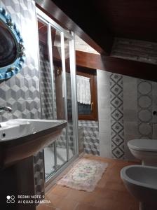 a bathroom with a sink and a toilet at B&B Giallo Siena in Colli al Volturno
