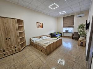 Postel nebo postele na pokoji v ubytování Coin Apartments & Poshtel