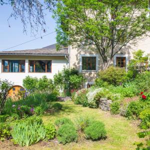 a garden in front of a house at Maison Cimes in Les Orres