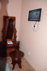 TV a/nebo společenská místnost v ubytování WAMALA RESORT HOTEL SSESE