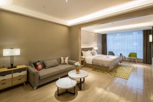 Postel nebo postele na pokoji v ubytování Morning Hotel, Changsha Provincial Government Metro Station