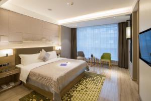 Postel nebo postele na pokoji v ubytování Morning Hotel, Changsha Provincial Government Metro Station + 5 fotografií